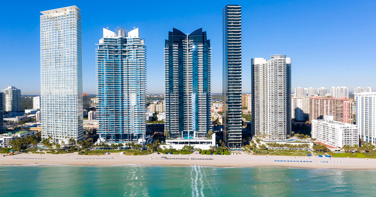 Aerial drone view of the Miami coastline at sunset